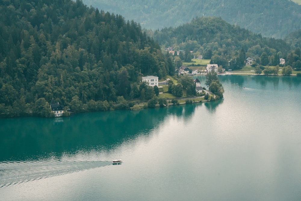 a small boat traveling across a large body of water