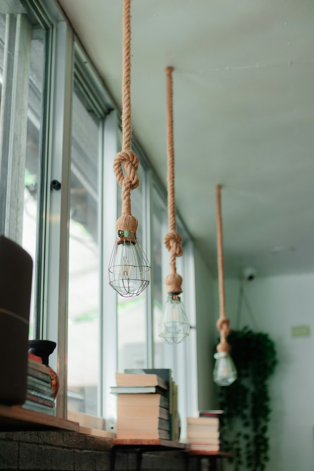 a couple of hanging lights in a room