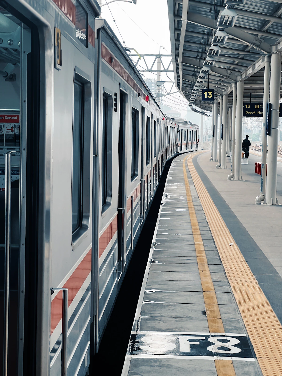 Station ticket barriers on a railway concourse