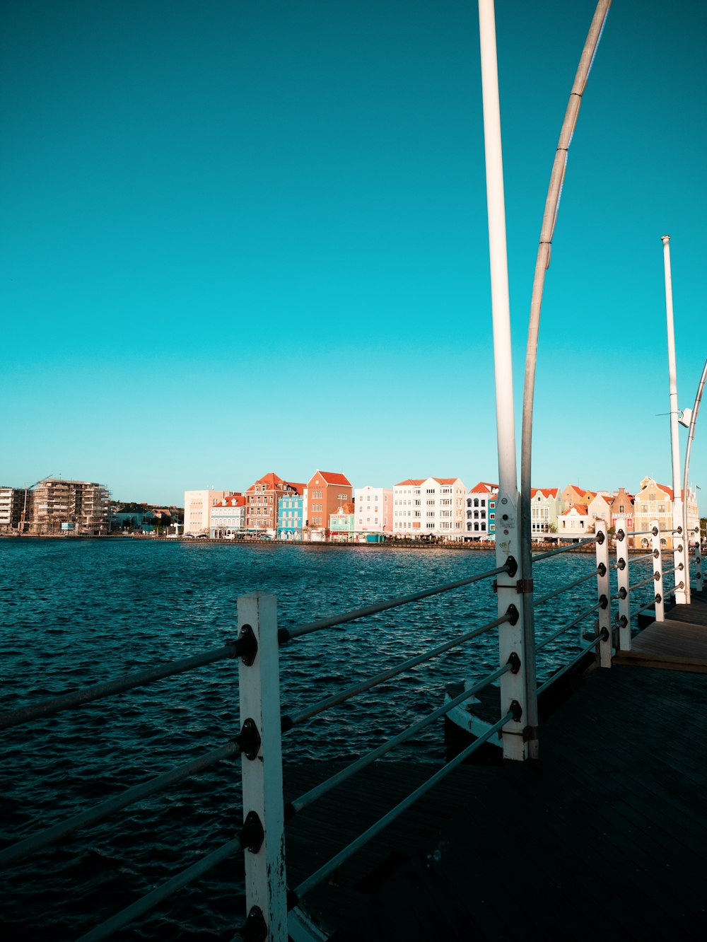 a view of a body of water with buildings in the background