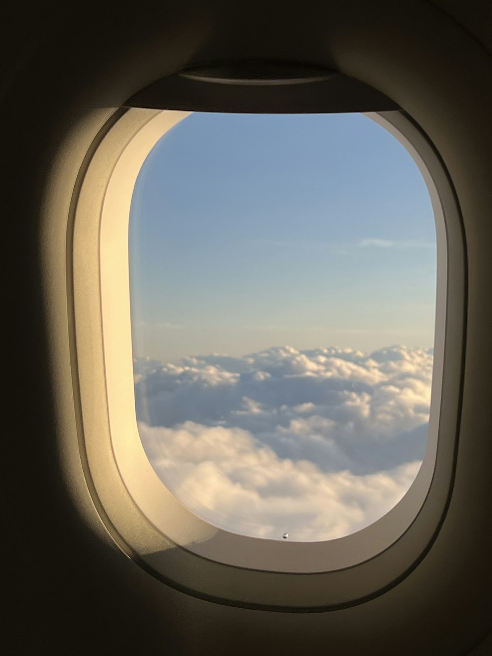 a view of the clouds from an airplane window