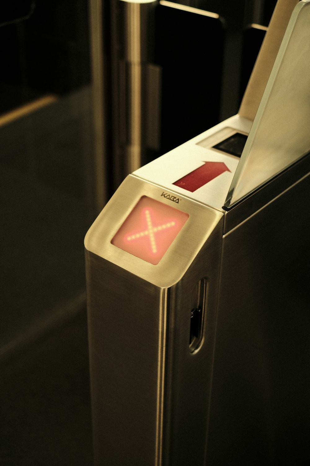 a close up of a machine with a red light on it