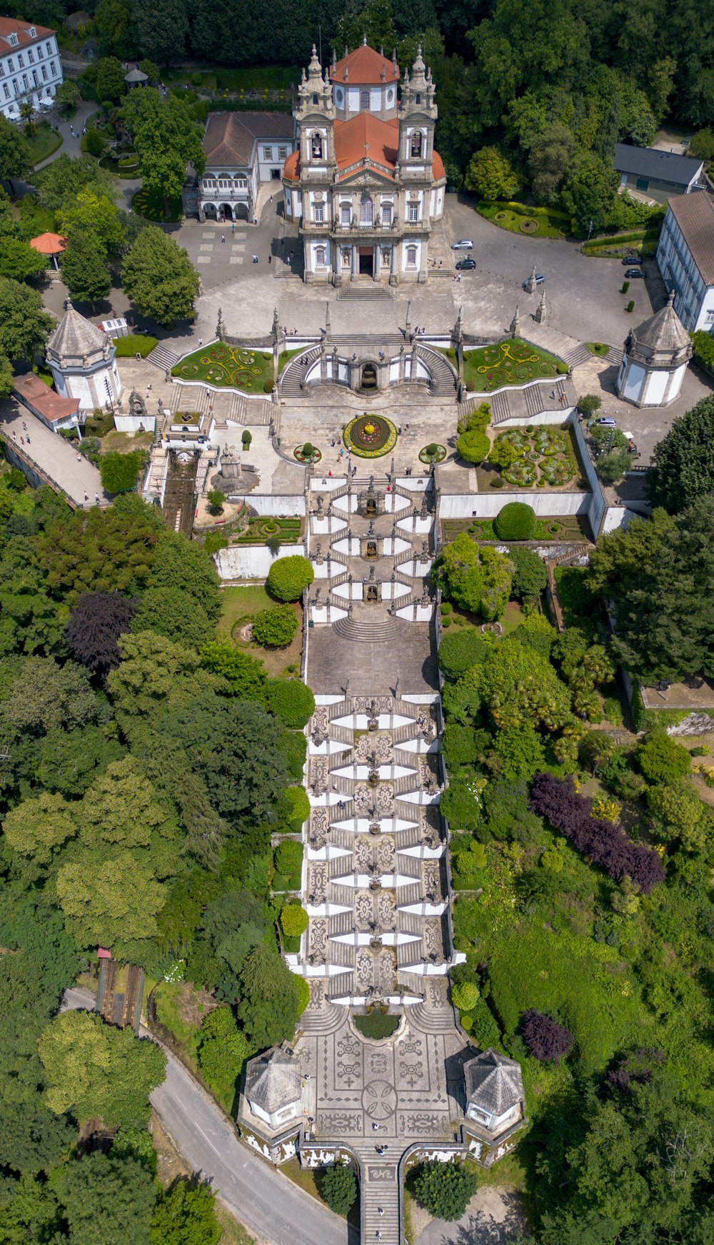 an aerial view of a building surrounded by trees