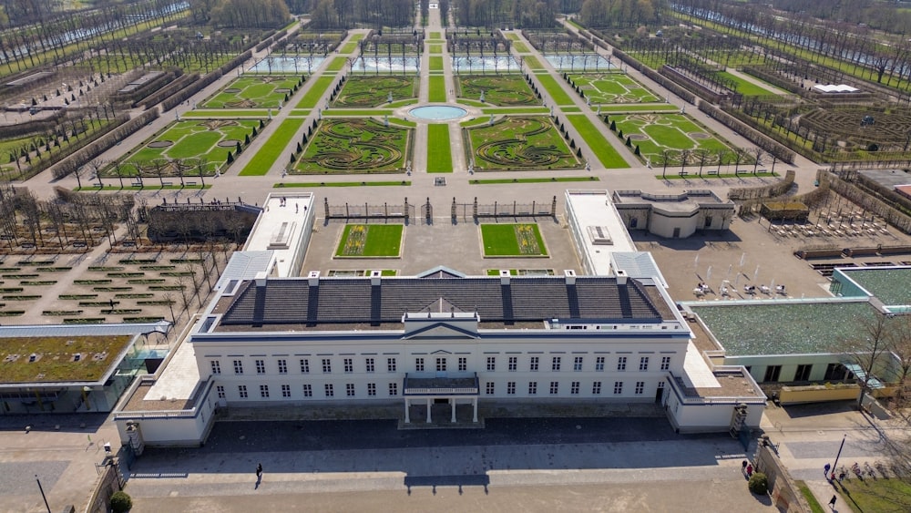 an aerial view of a large building in a park