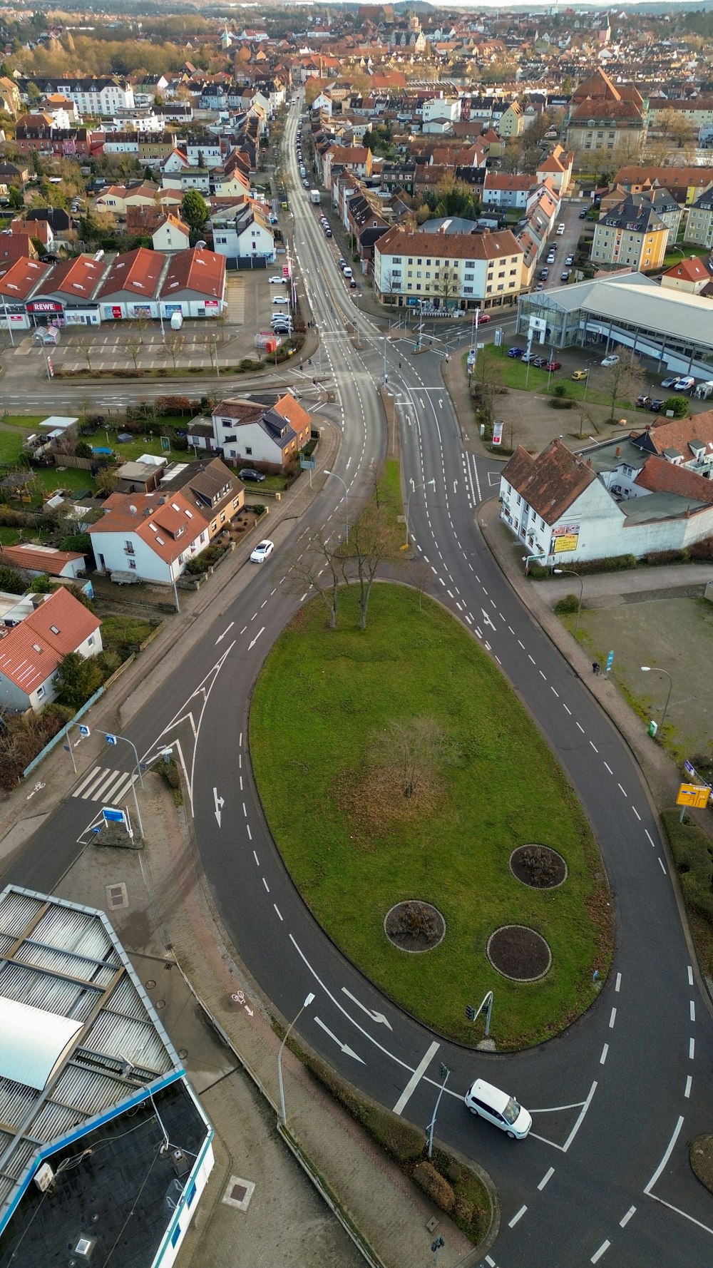 an aerial view of a city with a road running through it