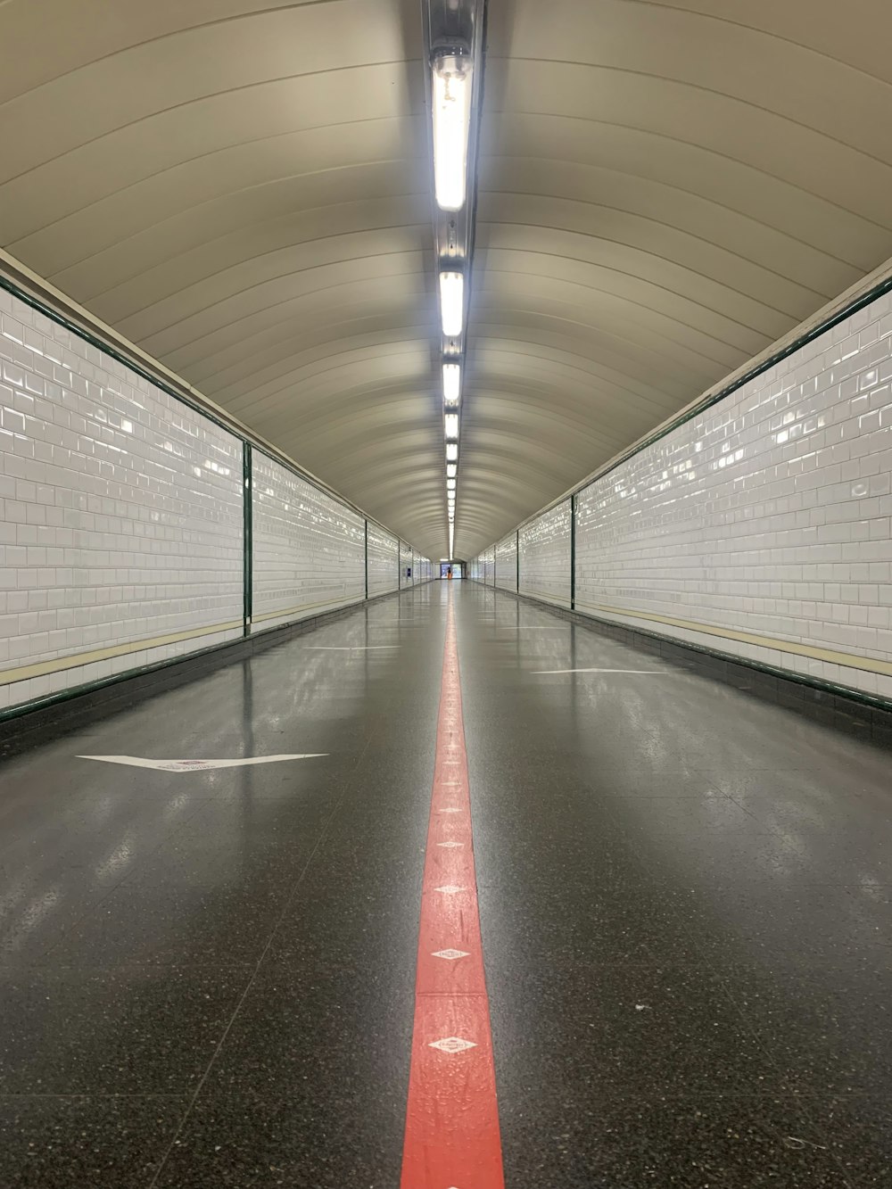 a long tunnel with a red line going through it