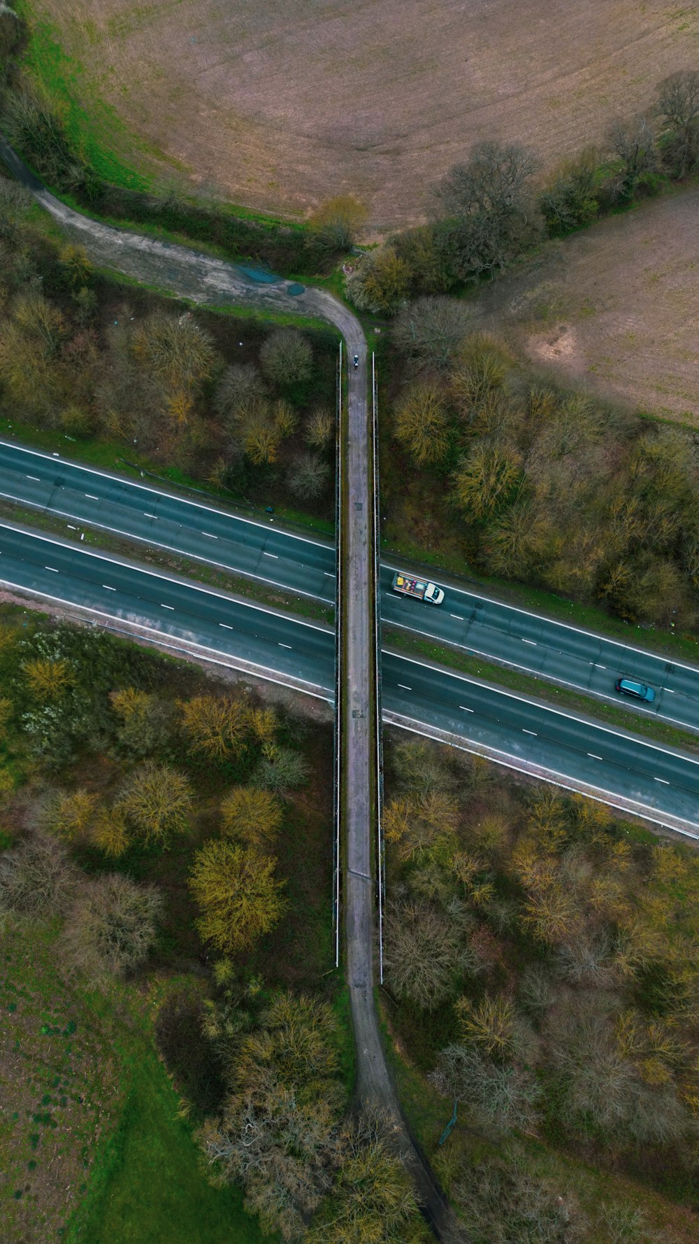 an aerial view of a highway with two lanes