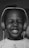A joyful customer wearing headphones with a big smile.