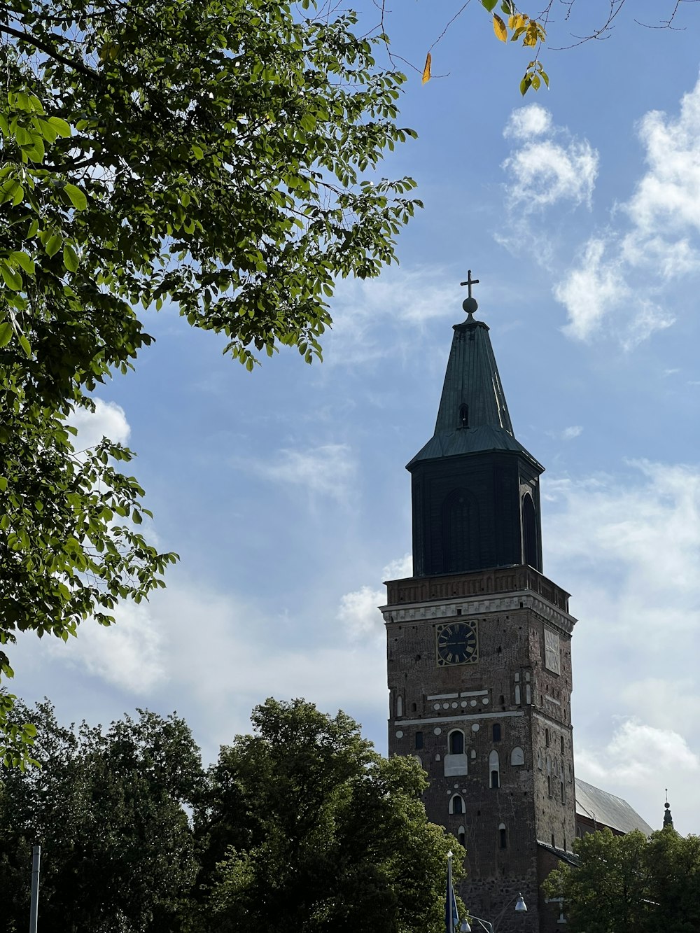 a tall tower with a clock on the top of it