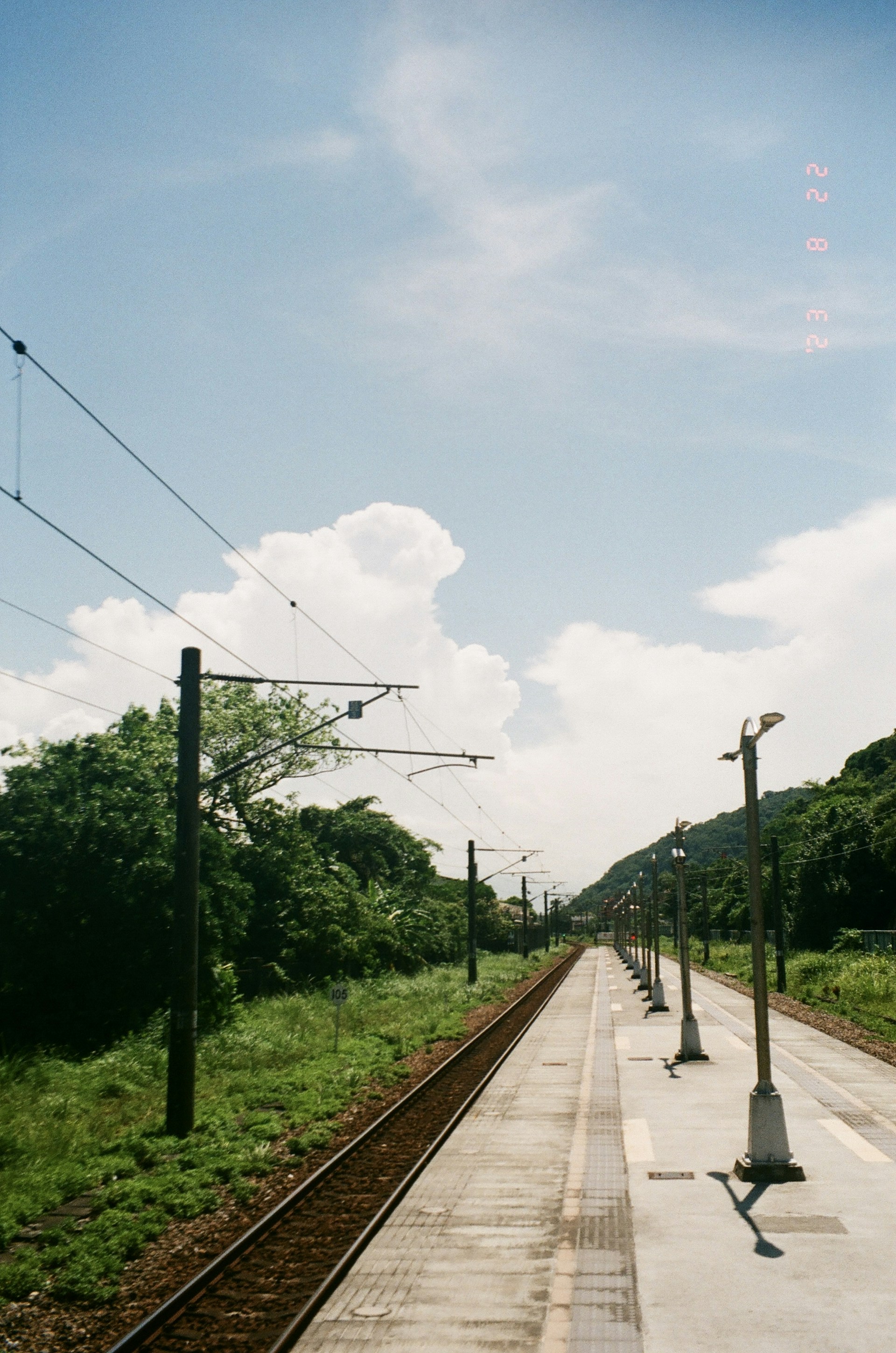 woman wearing yellow long-sleeved dress under white clouds and blue sky during daytime