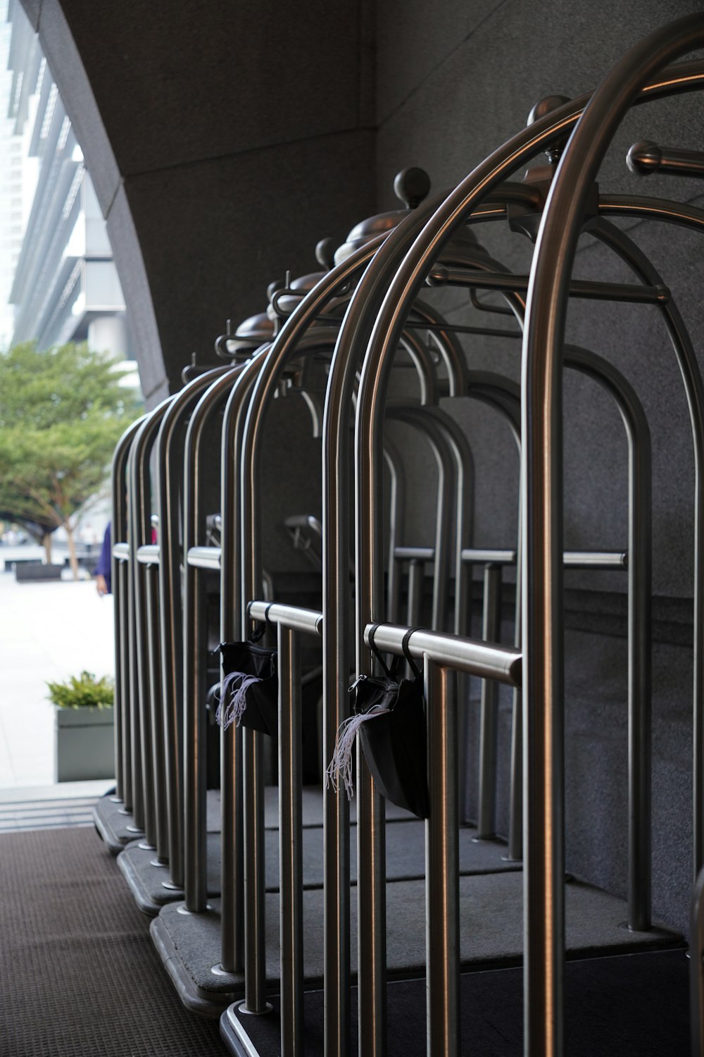 a row of metal bars on the side of a building