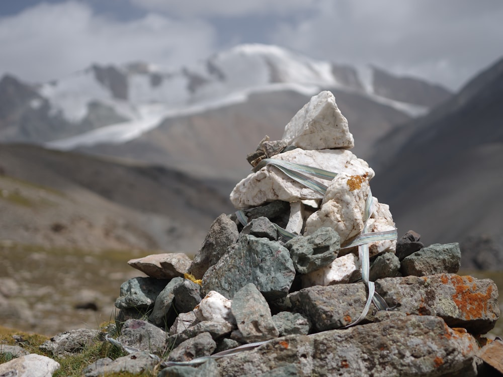 a pile of rocks with a mountain in the background