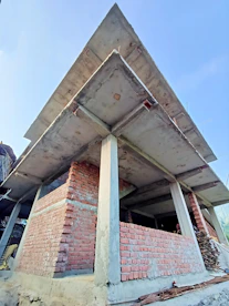 a very tall brick structure sitting under a blue sky