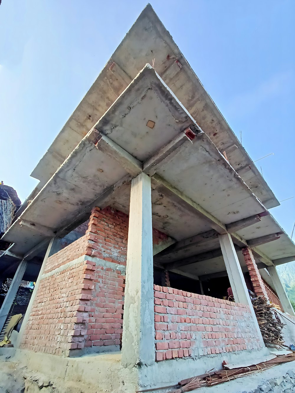 a very tall brick structure sitting under a blue sky