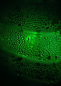 Close-up of a clean HVAC coil with droplets of condensation highlighting its freshness.