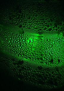 Close-up of a sleek bioclimatizer vent with water droplets indicating cooling effect.