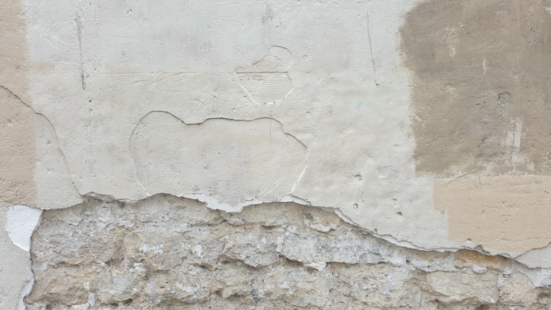Wall surface showing paint and plaster condition needing repair