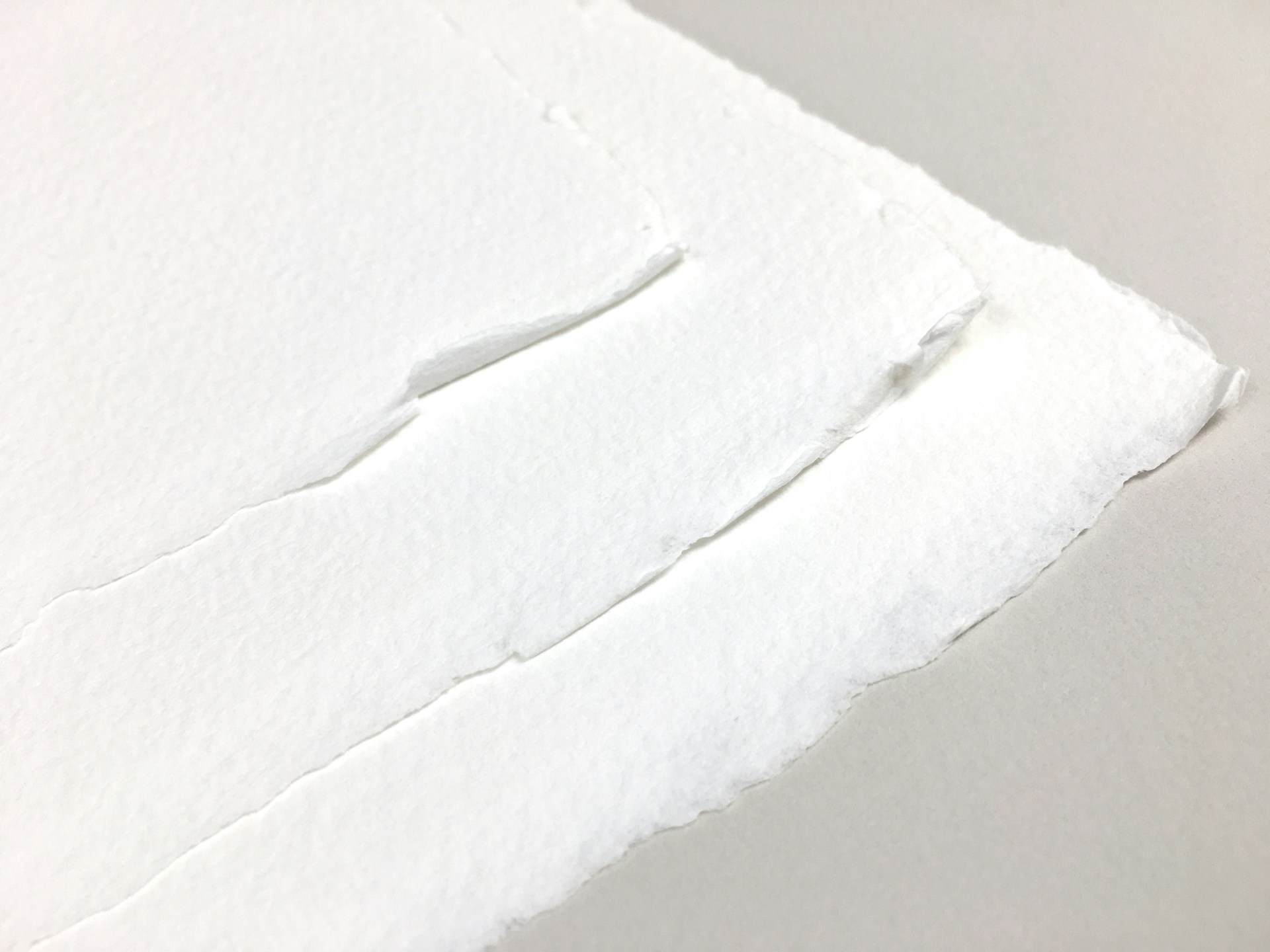 a piece of white paper with a hole in it