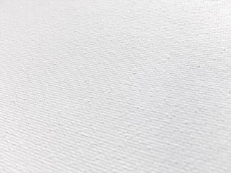 a close up of a white fabric texture