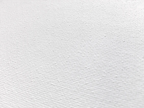 Close-up photo showing the texture of a canvas print stretched over a sturdy 3cm wooden frame.