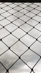 A beautiful installation of diamond mesh fencing in a rural setting.