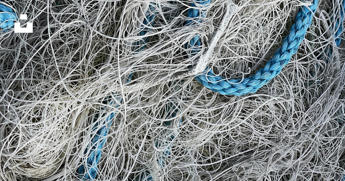 A pile of blue and white rope on top of a pile of white rope photo ...