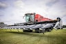 a large tractor is parked in a field
