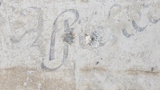 A faded handwritten lyric sheet with the words 'The Sign' partially visible.