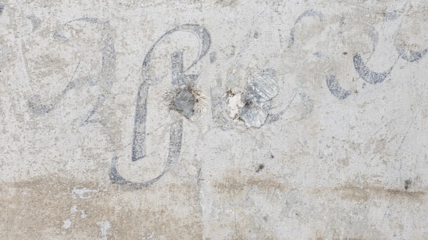 A faded handwritten lyric sheet with the words 'The Sign' partially visible.