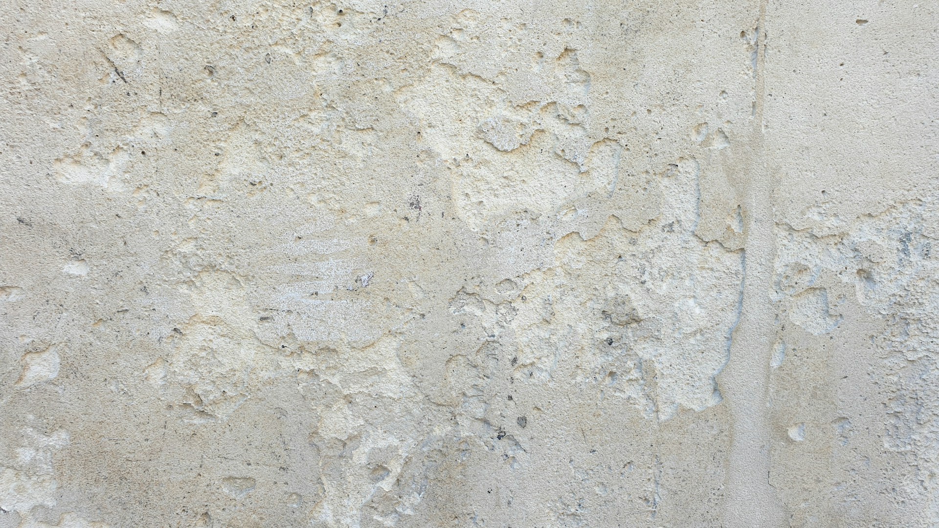 a close up of a white stucco wall
