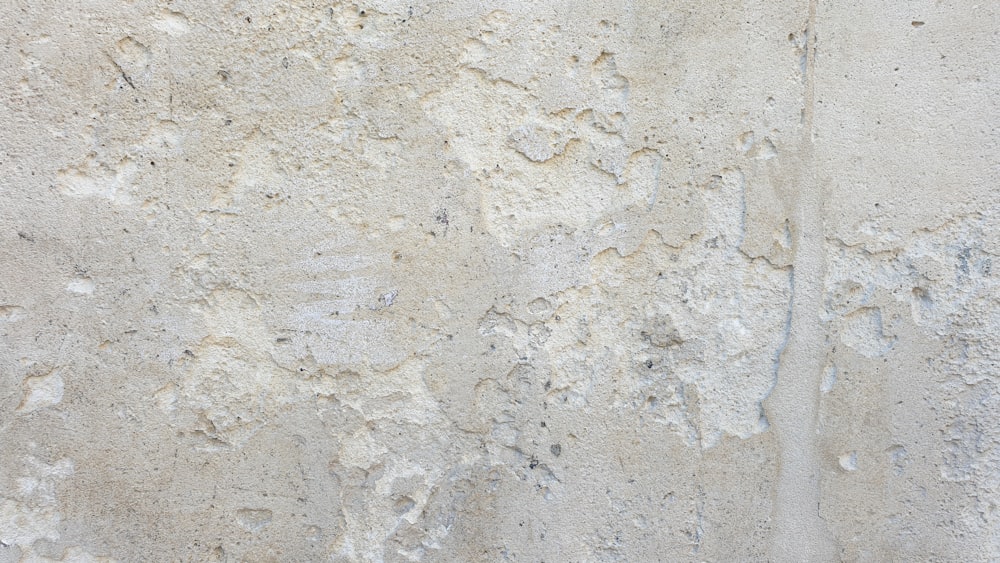 a close up of a white stucco wall