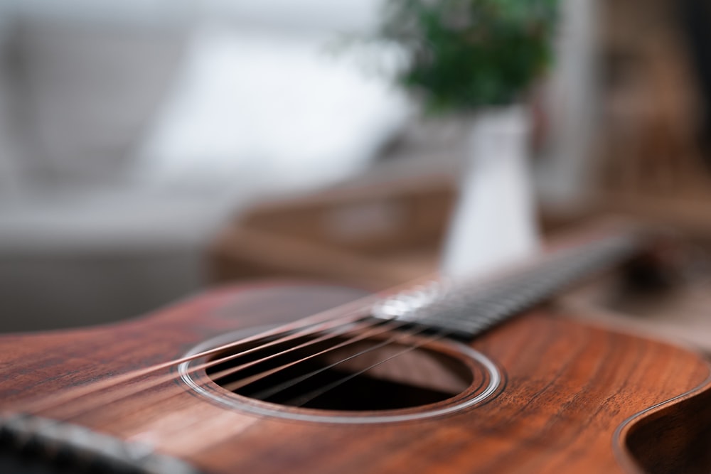 a close up of a guitar on a table