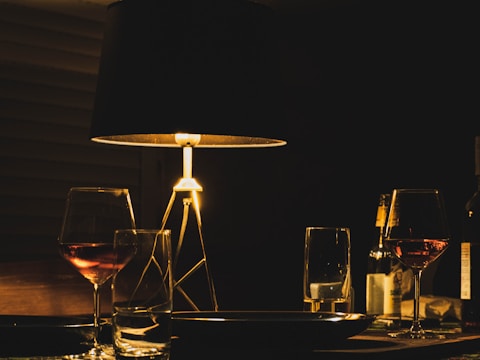 Cozy dining table set for an intimate gathering with soft lighting.