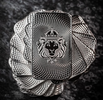 a silver ring with a lion on it