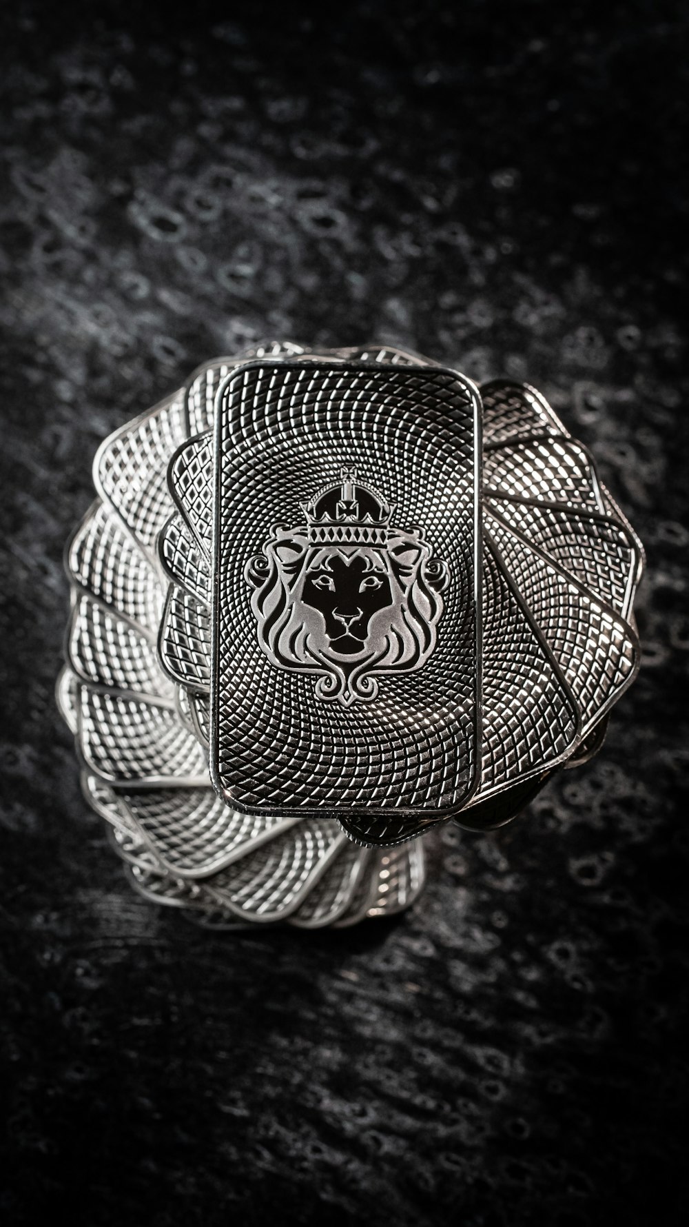 a silver ring with a lion on it