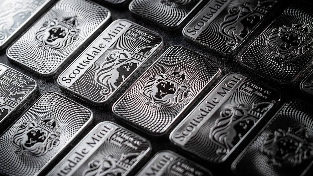 a pile of silver bars sitting on top of a table