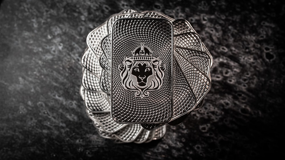 a silver ring with a lion on it