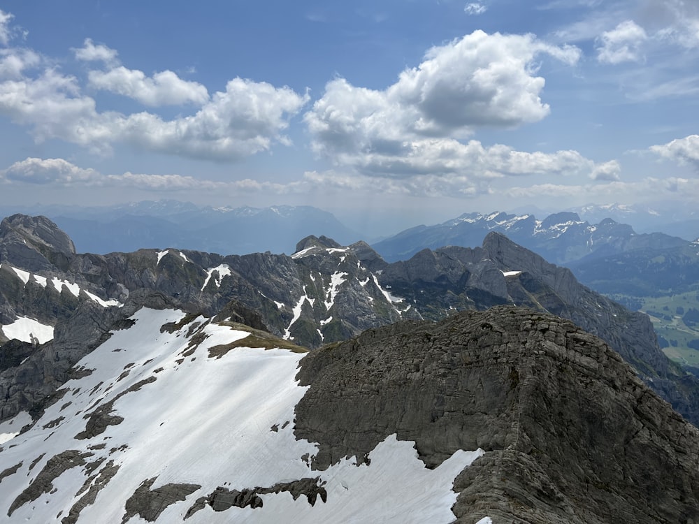 a view of the top of a mountain with snow on it