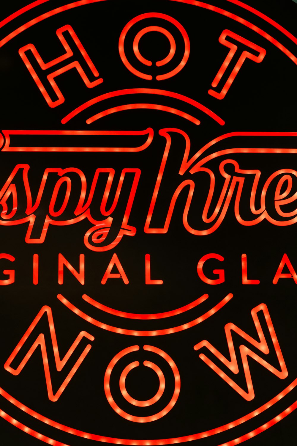 a neon sign that says hot snappy three original glass