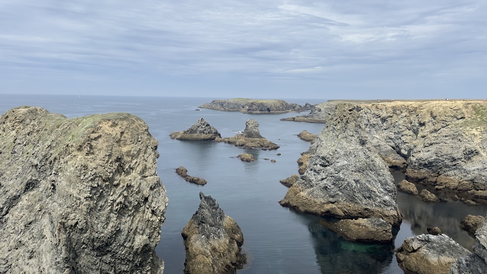 a body of water surrounded by large rocks