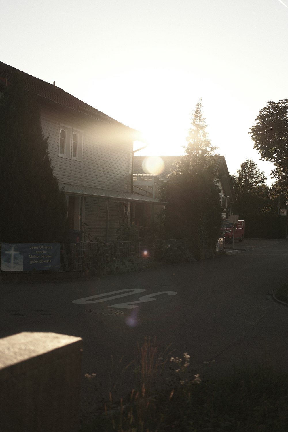 the sun is shining down on a residential street