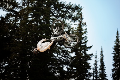 A rider performing a stunt on a downhill track.