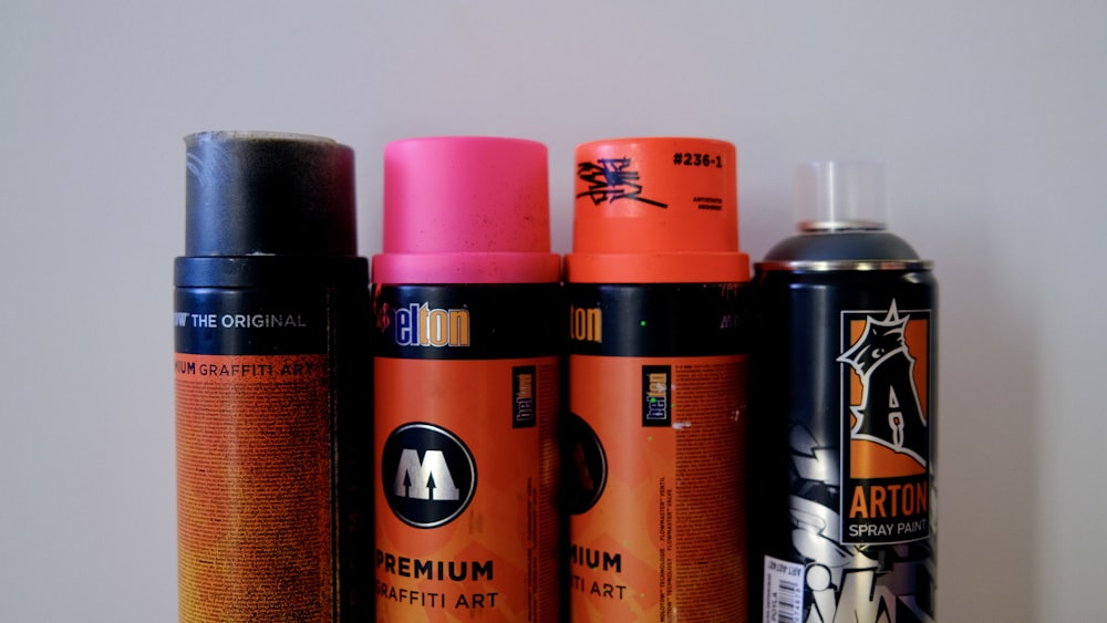 a group of different types of spray paint