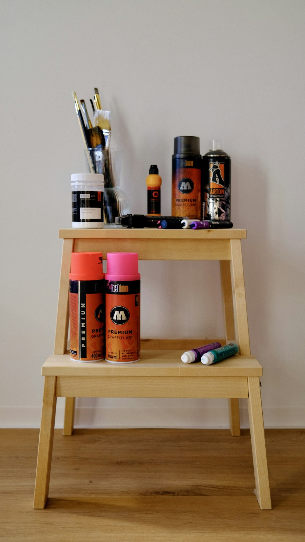a wooden shelf with various items on top of it