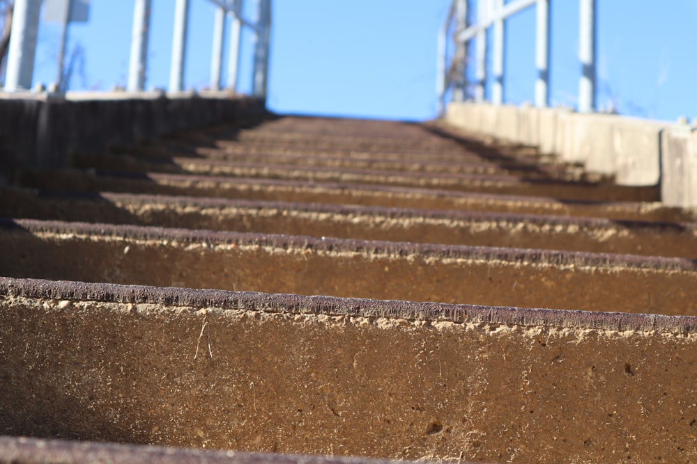a row of concrete steps with a blue sky in the background