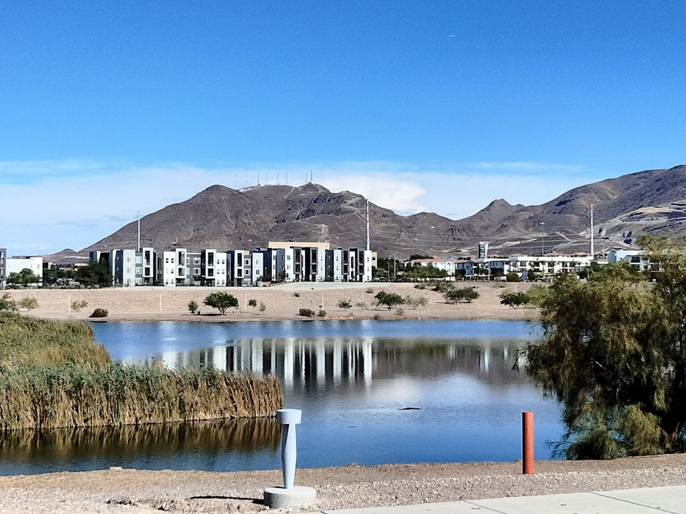 a body of water with buildings in the background