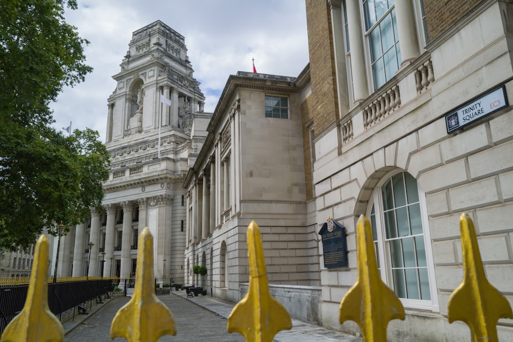 a large building with a clock tower in the background