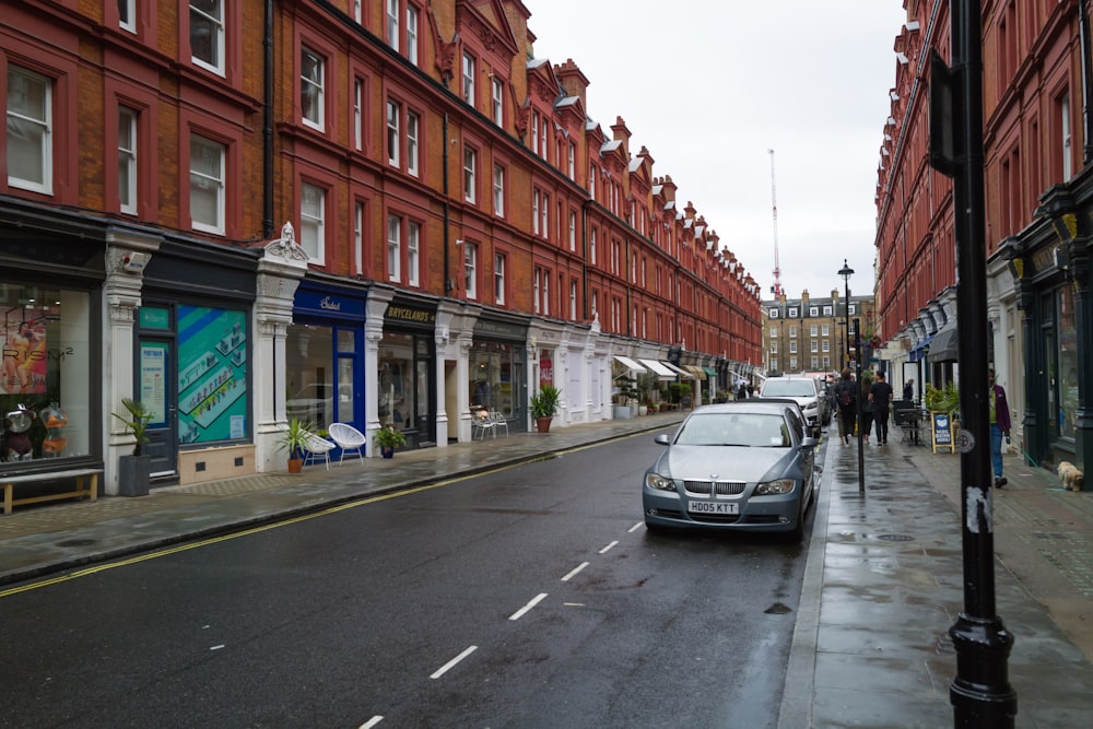 a car is parked on the side of the street