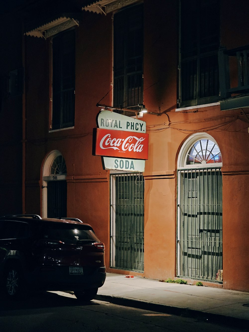 a red building with a coca cola sign on it