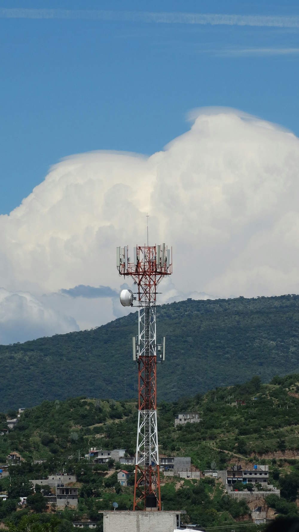 a tower with a cell phone on top of it